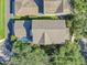 An aerial view shows a private pool and lush greenery surrounding the home at 6207 Bleeker St, Riverview, FL 33578