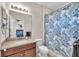 This bathroom has a simple vanity and toilet with a curtained shower at 6207 Bleeker St, Riverview, FL 33578