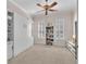 Bedroom with built-in shelving, a ceiling fan, and carpet flooring at 6207 Bleeker St, Riverview, FL 33578