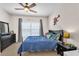 A bedroom featuring bed with blue bedding, cartoon wall art, and matching dresser at 6207 Bleeker St, Riverview, FL 33578