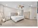 Bright bedroom featuring carpeted floors, neutral tones, and a comfortable bed with a cushioned headboard at 6207 Bleeker St, Riverview, FL 33578