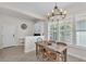 Dining room featuring a rustic table and natural lighting at 6207 Bleeker St, Riverview, FL 33578