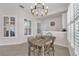 Dining room with unique light fixture and windows at 6207 Bleeker St, Riverview, FL 33578