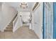 Spacious foyer featuring tile floors, a staircase, and a view into the home's open layout at 6207 Bleeker St, Riverview, FL 33578