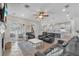 Living room that opens to the kitchen, with ample seating and sliding glass doors at 6207 Bleeker St, Riverview, FL 33578