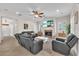 Cozy living room featuring a fireplace, ceiling fan, and comfortable seating at 6207 Bleeker St, Riverview, FL 33578
