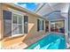 Inviting backyard pool featuring a screened-in patio area, perfect for relaxation and outdoor entertaining at 6207 Bleeker St, Riverview, FL 33578