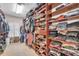 Spacious walk-in closet with extensive shelving and storage space for clothes, shoes, and accessories at 6207 Bleeker St, Riverview, FL 33578