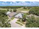 A birds eye view showing the community landscaping with a beautiful home and solar panels at 6351 Desert Peace Ave, Land O Lakes, FL 34639