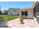 Backyard with a brick paver patio, outdoor furniture, and an area for relaxing outdoors and peaceful enjoyment at 6351 Desert Peace Ave, Land O Lakes, FL 34639