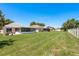 Expansive backyard with well-maintained lawn and a fence for added privacy at 6351 Desert Peace Ave, Land O Lakes, FL 34639