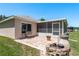 Backyard with a brick paver patio, an outdoor fire pit, and a peaceful seating area for relaxing outdoors at 6351 Desert Peace Ave, Land O Lakes, FL 34639
