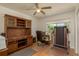 Home office space featuring desk, hutch, natural light and room for excercise equipment at 6351 Desert Peace Ave, Land O Lakes, FL 34639