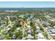 Aerial view showcasing property and location amenities, including nearby lake and tree coverage at 6730 10Th Avenue S Ter, St Petersburg, FL 33707