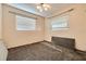 Bedroom with a ceiling fan and natural light from two windows at 6730 10Th Avenue S Ter, St Petersburg, FL 33707
