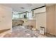 Updated kitchen with modern cabinets, tile backsplash, and space-saving microwave at 6730 10Th Avenue S Ter, St Petersburg, FL 33707