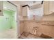 Bright kitchen area with white cabinets, ample counter space and potential for customization at 6730 10Th Avenue S Ter, St Petersburg, FL 33707