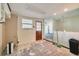 Partially renovated kitchen with tile floors, open access to other rooms, and lots of natural light at 6730 10Th Avenue S Ter, St Petersburg, FL 33707