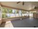 Relaxing sunroom with views of the fenced-in backyard at 6730 10Th Avenue S Ter, St Petersburg, FL 33707