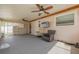 Spacious sunroom with ceiling fans, ample seating, and backyard access at 6730 10Th Avenue S Ter, St Petersburg, FL 33707