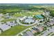 Community aerial view showcasing pools, clubhouse, tennis courts, parks, and residential housing at 8332 Swiss Chard Cir, Land O Lakes, FL 34637