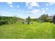 Lush backyard with playground, fire pit and ample space for outdoor activities at 8332 Swiss Chard Cir, Land O Lakes, FL 34637