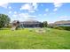 Spacious backyard with a fire pit, playground, and plenty of green space at 8332 Swiss Chard Cir, Land O Lakes, FL 34637