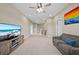 Spacious bonus room with neutral carpet, a ceiling fan and a TV with ocean view at 8332 Swiss Chard Cir, Land O Lakes, FL 34637