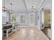 Bright dining area featuring modern pendant lighting and elegant tile flooring, perfect for Gathering meals at 8332 Swiss Chard Cir, Land O Lakes, FL 34637