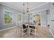 Inviting dining space featuring natural light and stylish pendant lighting, perfect for comfortable dining experiences at 8332 Swiss Chard Cir, Land O Lakes, FL 34637