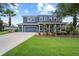 Stunning two-story home boasting lush landscaping and a convenient three-car garage in a desirable neighborhood at 8332 Swiss Chard Cir, Land O Lakes, FL 34637