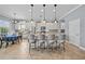 Kitchen features a large island with barstool seating, granite countertops, and stainless steel appliances at 8332 Swiss Chard Cir, Land O Lakes, FL 34637
