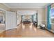 Main bedroom showing hardwood flooring, natural light and open entry to main bath at 8332 Swiss Chard Cir, Land O Lakes, FL 34637