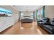 Main bedroom features hardwood floors, a sitting area, and lots of natural light at 8332 Swiss Chard Cir, Land O Lakes, FL 34637