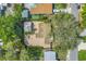 Overhead aerial view of the property showcasing the roof, yard, and mature trees at 914 Sandpiper Way S, St Petersburg, FL 33707