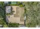 Aerial view of a home featuring a brick paved driveway and lush landscaping surrounding the property at 914 Sandpiper Way S, St Petersburg, FL 33707