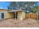 Spacious fenced backyard with brick pavers and covered structure at 914 Sandpiper Way S, St Petersburg, FL 33707