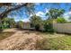 Charming single-story home with yellow siding, an attached garage, and brick paved driveway at 914 Sandpiper Way S, St Petersburg, FL 33707