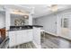 Open living space with sleek breakfast bar, ceiling fan, and lots of natural light at 914 Sandpiper Way S, St Petersburg, FL 33707