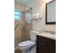 Bathroom showcasing a walk in shower and a modern vanity at 9218 40Th N Way, Pinellas Park, FL 33782