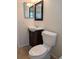 Bathroom featuring a vanity with dark wood cabinet and a coordinating framed mirror at 9218 40Th N Way, Pinellas Park, FL 33782