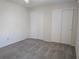 Bedroom features carpet flooring and a ceiling fan with great closet space at 9218 40Th N Way, Pinellas Park, FL 33782