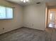 Bedroom showcasing neutral carpeting, a window, and access to the hallway at 9218 40Th N Way, Pinellas Park, FL 33782