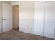 Bedroom with a closet and neutral carpeting, offering storage at 9218 40Th N Way, Pinellas Park, FL 33782
