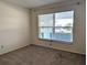 Bedroom with neutral carpet and large window, providing ample natural light at 9218 40Th N Way, Pinellas Park, FL 33782