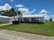Charming single-story home with a manicured lawn and lovely landscaping at 9218 40Th N Way, Pinellas Park, FL 33782
