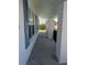 Inviting covered porch with brick columns and blue shutters, adding curb appeal at 9218 40Th N Way, Pinellas Park, FL 33782