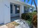 Inviting front porch with a well-manicured garden and a charming entrance at 9218 40Th N Way, Pinellas Park, FL 33782