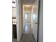 Hallway with wood-look flooring leading to the bedroom and bathroom at 9218 40Th N Way, Pinellas Park, FL 33782