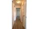 Hallway with a wood-look floor, leading to bedrooms and bathroom at 9218 40Th N Way, Pinellas Park, FL 33782